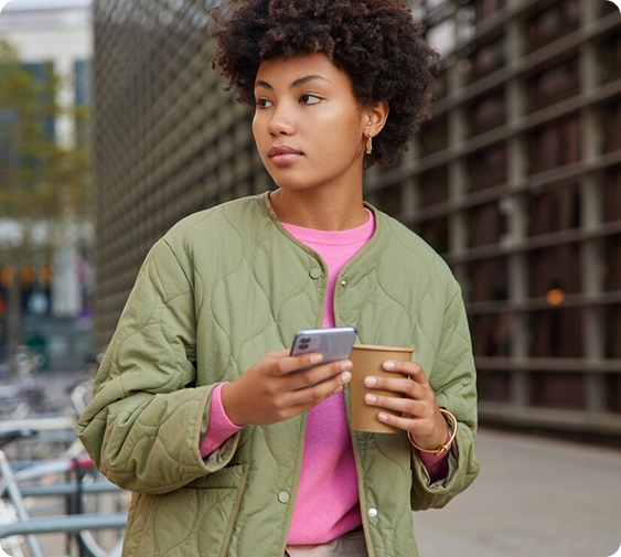 girl with phone and cup